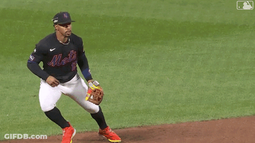 A Baseball Player Wearing A Jersey With The Number 2 On It Is Trying To Catch A Ball GIF