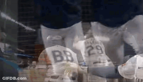 A Baseball Player Wearing A Jersey With The Number 29 On The Back GIF