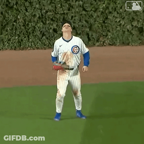 A Baseball Player Wearing A Jersey With The Number 4 On It Is Standing On The Field . GIF