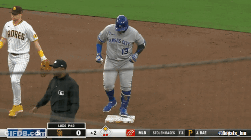 A Baseball Player Wearing A Kansas City Jersey Walks Towards The Base GIF