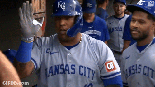 A Baseball Player Wearing A Kansas City Jersey Waving GIF
