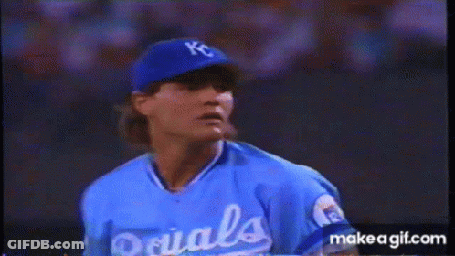 A Baseball Player Wearing A Kc Hat And Glove Is Getting Ready To Throw The Ball GIF