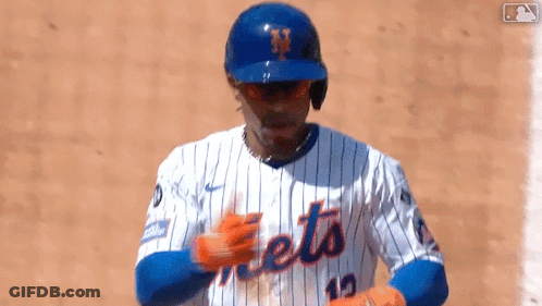 A Baseball Player Wearing A Mets Jersey And Helmet GIF