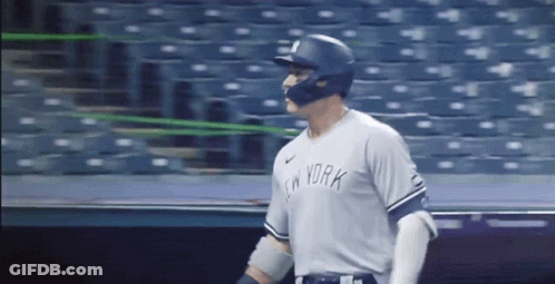 A Baseball Player Wearing A New York Jersey And Helmet GIF