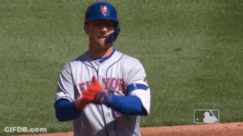 A Baseball Player Wearing A New York Jersey Is Throwing A Baseball . GIF