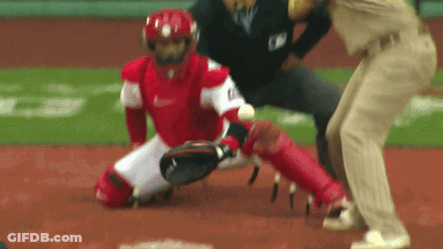 A Baseball Player Wearing A Nike Uniform Is Kneeling Down On The Field GIF