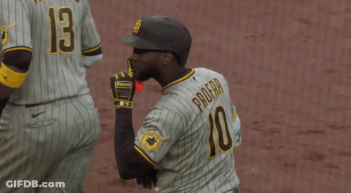 A Baseball Player Wearing A Number 10 Jersey Holds His Finger To His Lips GIF