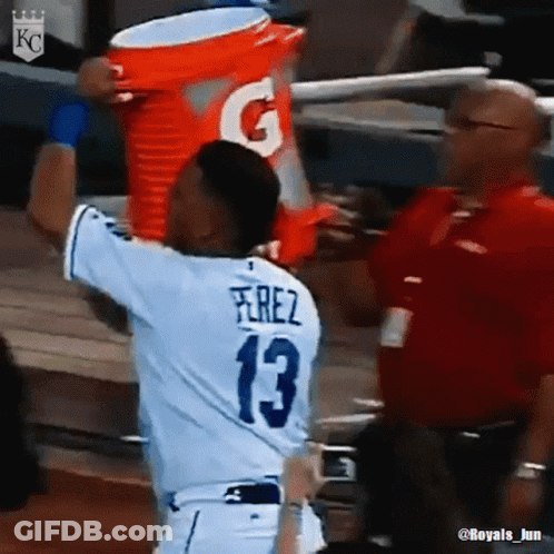 A Baseball Player Wearing A Number 13 Jersey Is Holding A Gatorade Bucket Over His Head GIF