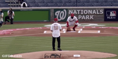 A Baseball Player Wearing A Number 19 Jersey Stands On The Mound GIF