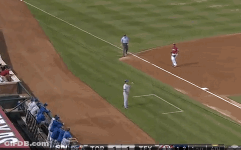 A Baseball Player Wearing A Number 2 Jersey Stands On The Field GIF