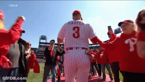 A Baseball Player Wearing A Number 3 Jersey Is Surrounded By Fans GIF