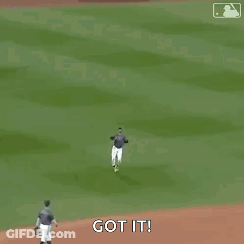 A Baseball Player Wearing A Nyc Jersey Is Walking On A Field . GIF