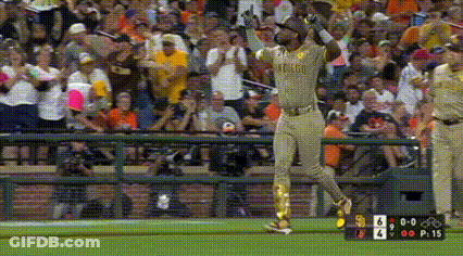 A Baseball Player Wearing A Oakland Uniform Is Running On The Field . GIF