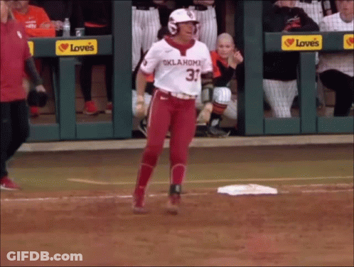A Baseball Player Wearing A Oklahoma Jersey Is Walking Towards The Base GIF