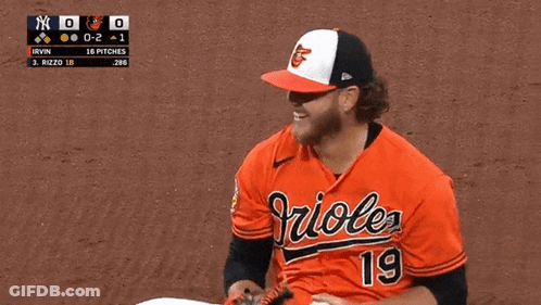 A Baseball Player Wearing A Orioles Jersey Is Holding A Ball GIF
