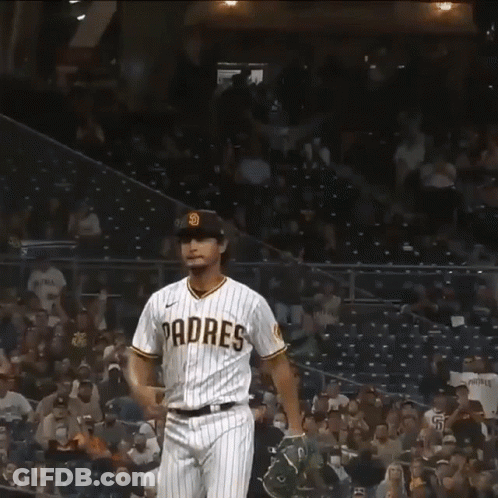 A Baseball Player Wearing A Padres Jersey Celebrates A Win GIF