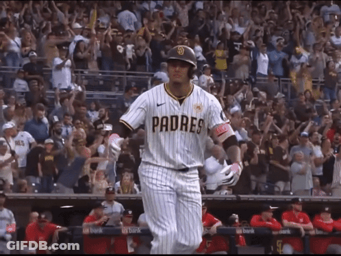 A Baseball Player Wearing A Padres Jersey Is Walking Towards The Dugout GIF