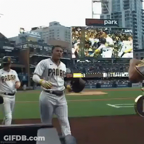 A Baseball Player Wearing A Padres Uniform Runs On The Field GIF