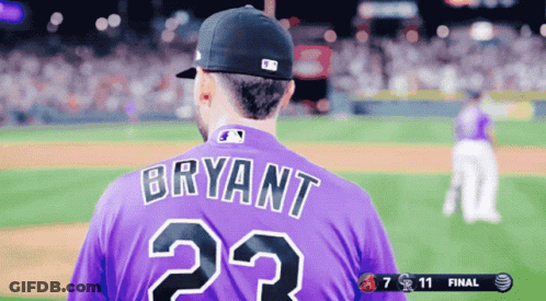 A Baseball Player Wearing A Purple Jersey With Bryant On It GIF