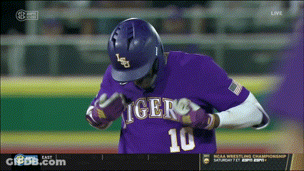 A Baseball Player Wearing A Purple Jersey With The Number 10 GIF