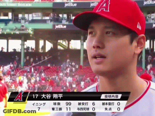 A Baseball Player Wearing A Red A Hat Stands In Front Of A Jetblue Banner GIF