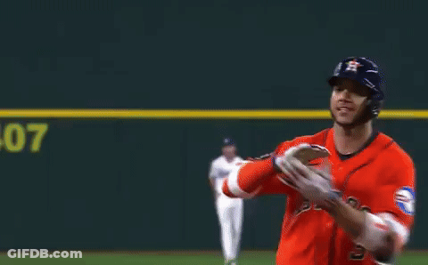 A Baseball Player Wearing A Red Astros Jersey Is Running On A Field GIF
