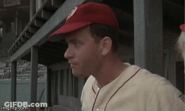 Baseball Player In Dugout Wearing Red Hat And White Jersey GIF