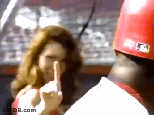 A Baseball Player Wearing A Red Hat With A Mlb Logo GIF