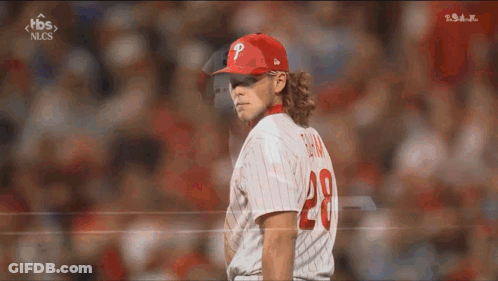 A Baseball Player Wearing A Red Hat With A P On It GIF