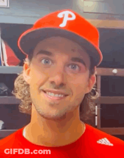 A Baseball Player Wearing A Red Hat With The Letter P On It GIF