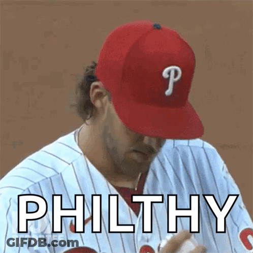 A Baseball Player Wearing A Red Hat With The Letter P On It GIF