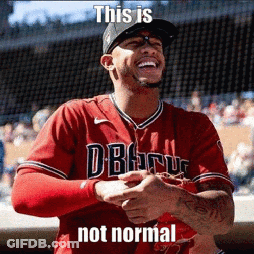 A Baseball Player Wearing A Red Jersey That Says " This Is Not Normal " On It GIF