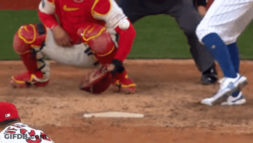 A Baseball Player Wearing A Red Jersey With The Number 33 On It GIF