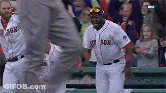 A Baseball Player Wearing A Red Sox Jersey Is Dancing GIF