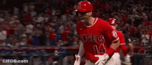 A Baseball Player Wearing A Red Uniform Is Running On The Field . GIF