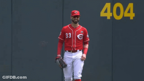 A Baseball Player Wearing A Red Uniform With The Number 33 On It GIF