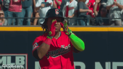 A Baseball Player Wearing A Red Uniform With The Word Guardians On The Front GIF