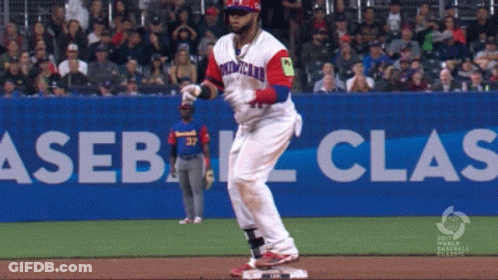 A Baseball Player Wearing A Red White And Blue Uniform With The Word Dominican On It GIF