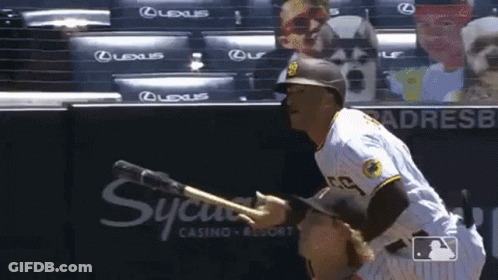A Baseball Player Wearing A San Diego Padres Uniform Is Pointing At Something GIF