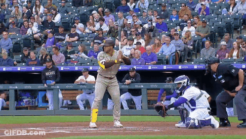 A Baseball Player Wearing A San Diego Padres Uniform Stands At Home Plate Ready To Bat GIF