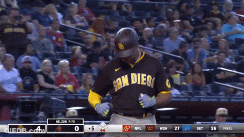 A Baseball Player Wearing A San Diego Uniform Stands In Front Of A Crowd GIF
