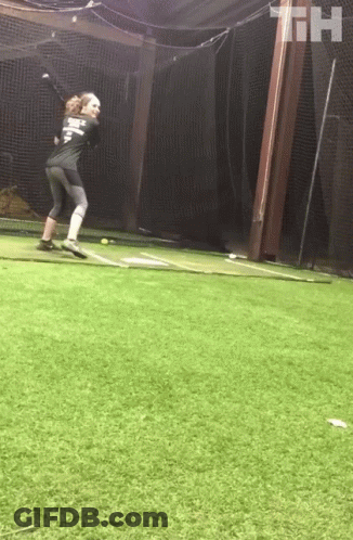A Baseball Player Wearing A Shirt That Says ' T.h. ' On It Is Throwing A Ball GIF