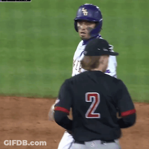 A Baseball Player Wearing A Tigers Jersey Talks To Another Player GIF