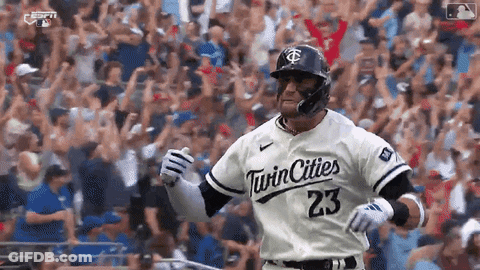 A Baseball Player Wearing A Twin Cities 23 Jersey Is Running On The Field . GIF