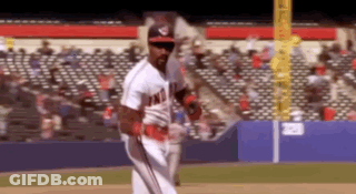 A Baseball Player Wearing A Washington Nationals Uniform Is Standing On The Field GIF