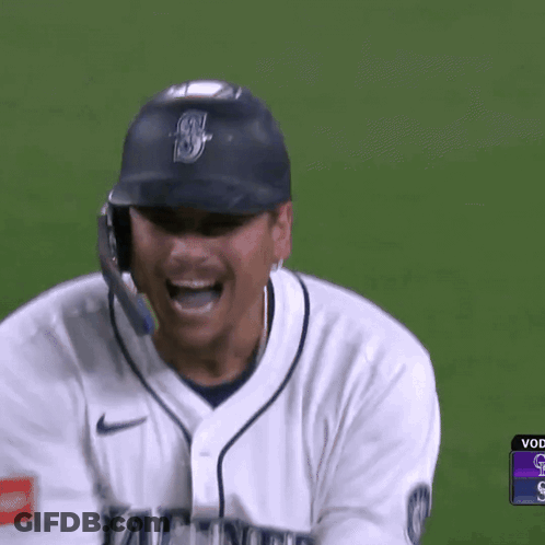 A Baseball Player Wearing A White Jersey That Says Mariner On It GIF