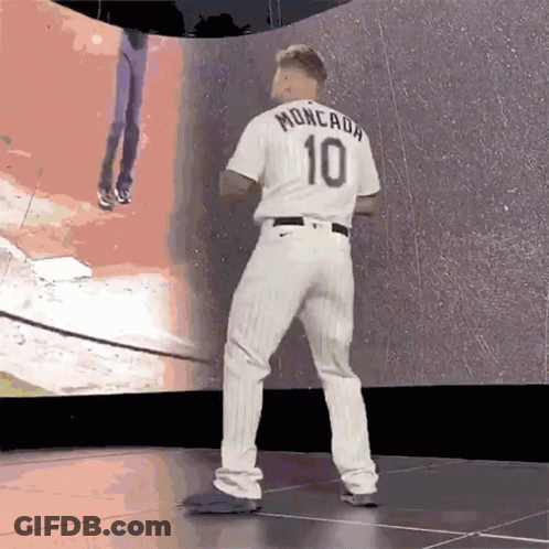 A Baseball Player Wearing A White Jersey With The Number 10 On It GIF