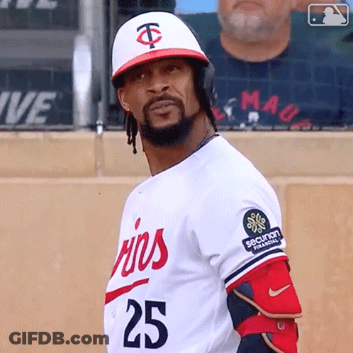 A Baseball Player Wearing A White Jersey With The Number 25 On It GIF