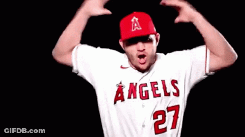 A Baseball Player Wearing A White Jersey With The Number 27 On It GIF
