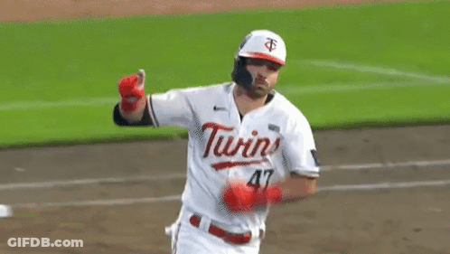 A Baseball Player Wearing A White Jersey With The Word Twins On It GIF